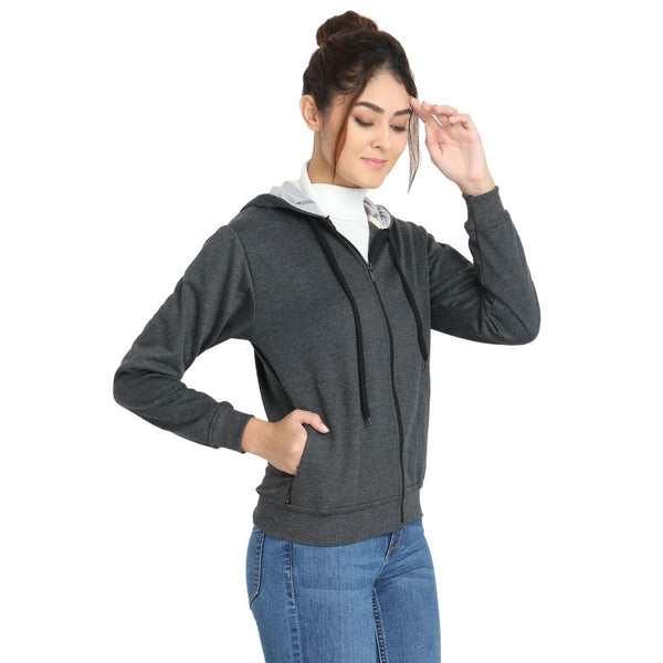 Side pose of Model wearing TeeMoods women's fleece Dark Grey hoodie in a happy mood
